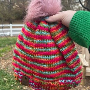 Hand knit beanie with faux fur pom pom